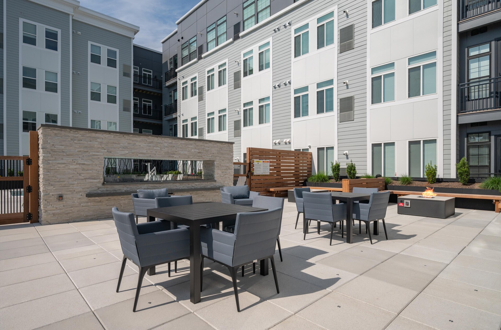 Outdoor firepit area with modern seating.