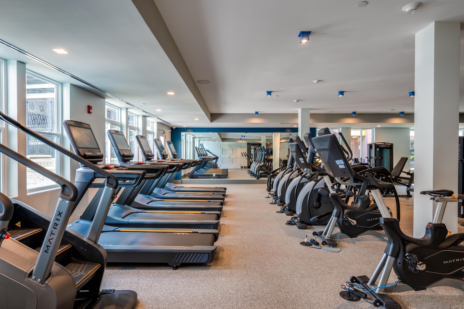Another view of the fitness room with cardio machines.